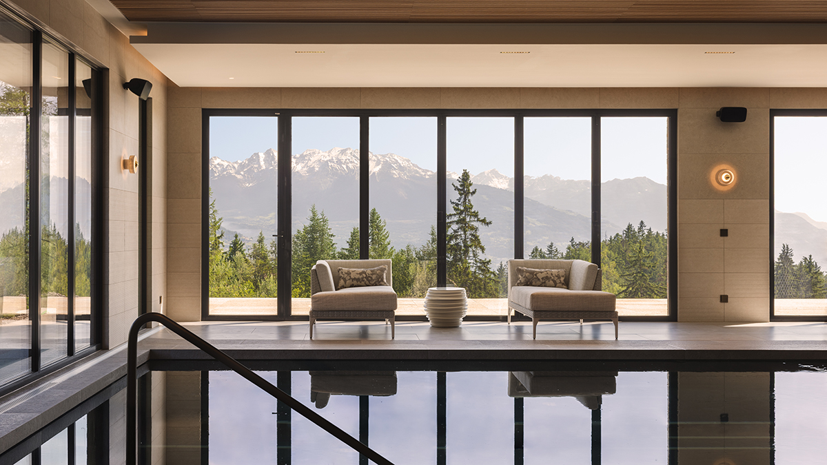 Inside a Swiss Chalet Centered Around a Huge, Sculptural Staircase